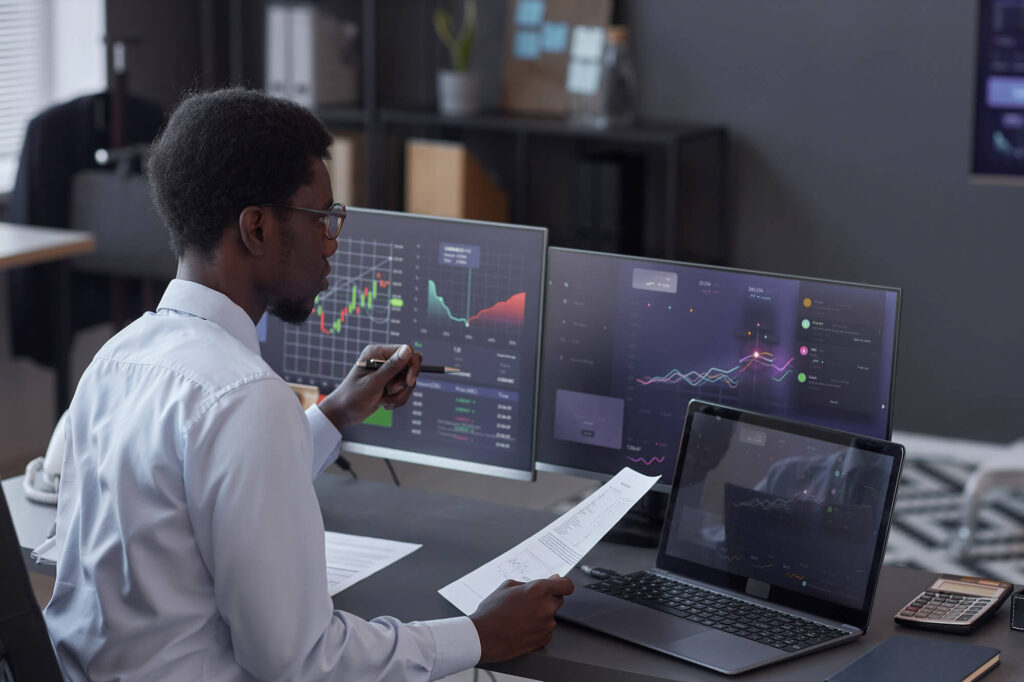 broker analyzing financial market in office 2023 11 27 04 56 50 utc.jpg