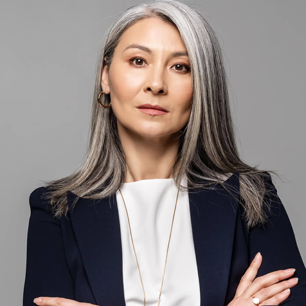 confident asian businesswoman with grey hair and c 2023 11 27 04 55 11 utc 1.jpg
