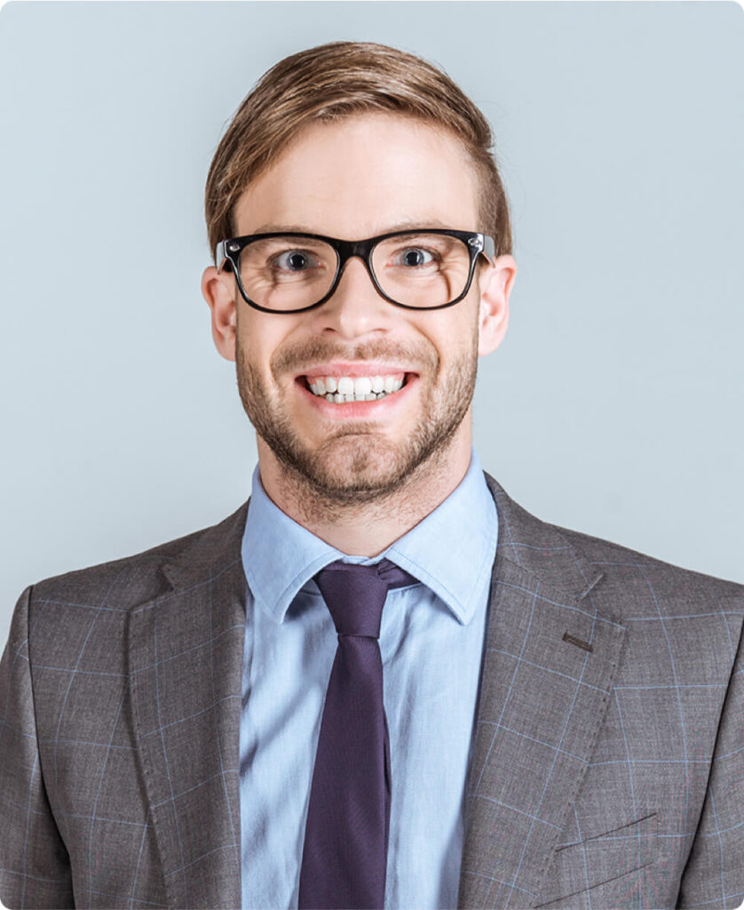 young smiling businessman with hands in pockets is 2023 11 27 05 07 42 utc.jpg